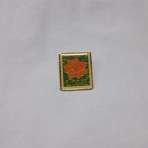 LOVE stamp pin with pink rose, USA and 25 on front of pin